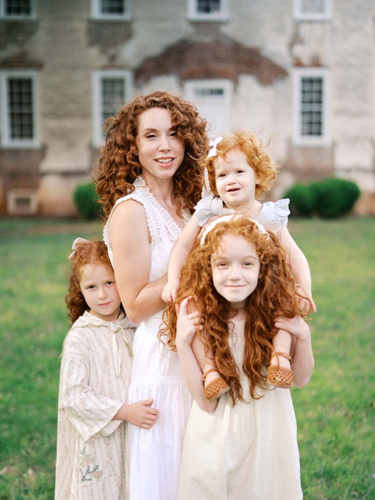 A family smiling at a family photography session by Katie Stansfield Photography.