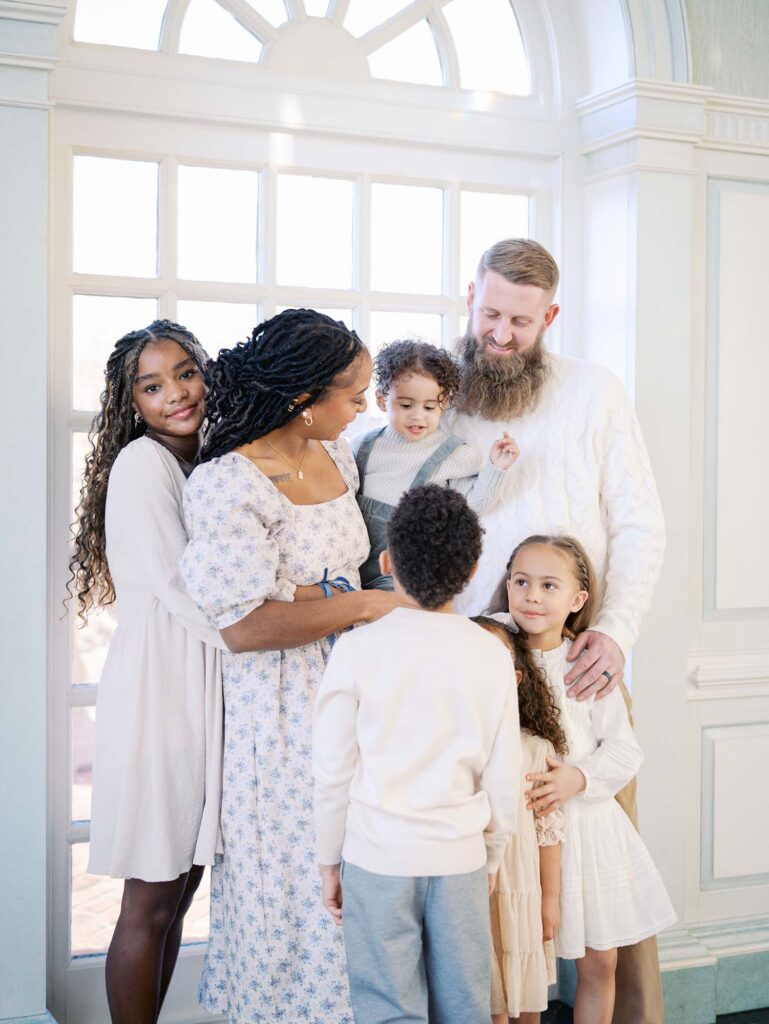 A family smiling at each other at a session to show how to choose a photographer for your family in Richmond, VA by Katie Stansfield Photography.