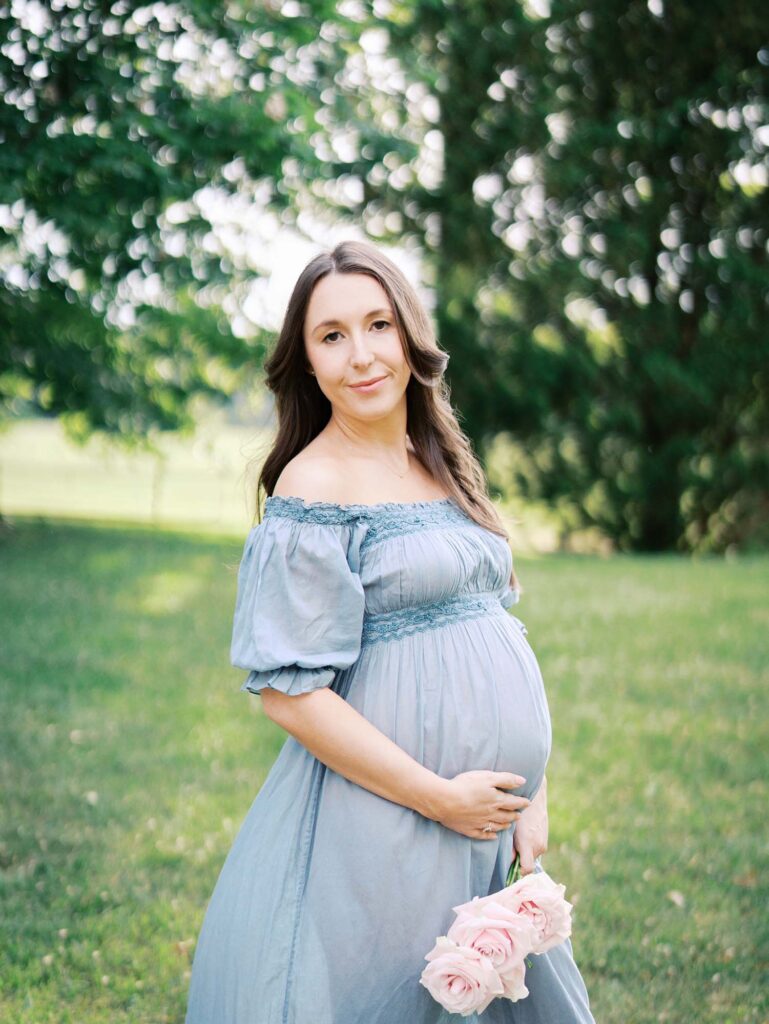 A mom holding her baby bump at one of the maternity photo locations in Henrico County, VA, by Katie Stansfield Photography.