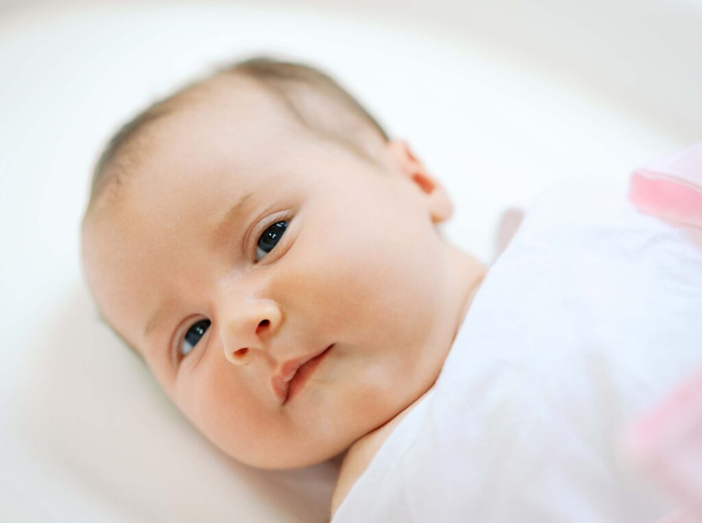 A baby swaddled at a newborn session by Katie Stansfield Photography.