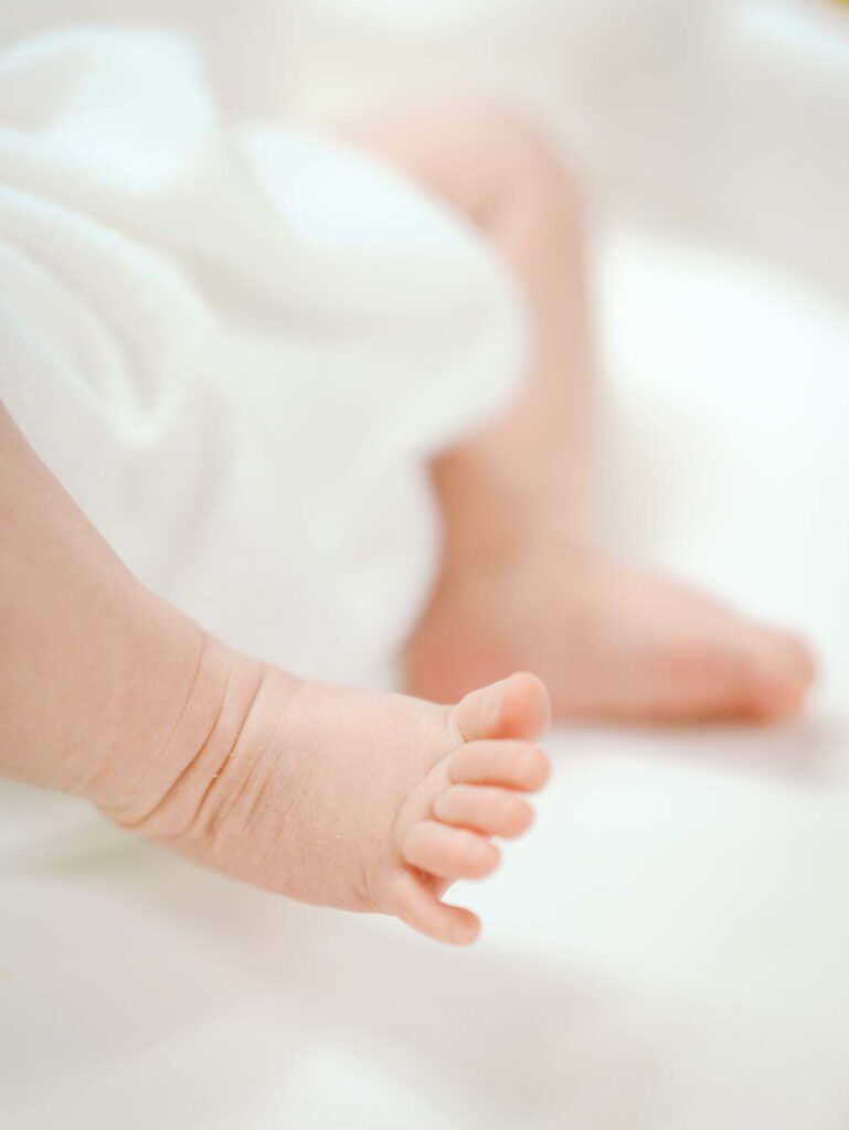 A close-up of a baby's foot at a newborn session by Katie Stansfield Photography.