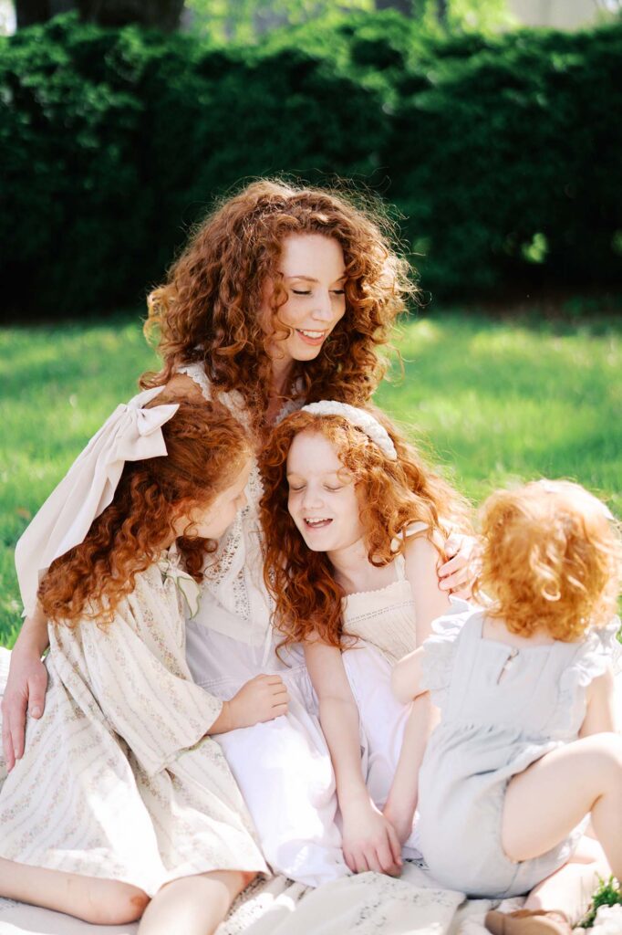 A family hugging and smiling by Katie Stansfield Photography, a family photographer in Short Pump VA.