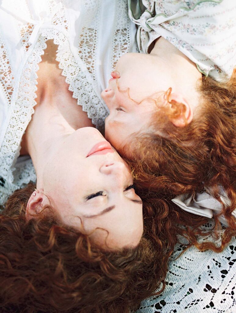 A close-up of a mom and daughter laying on a blanket at a family photography session by Katie Stansfield Photography.