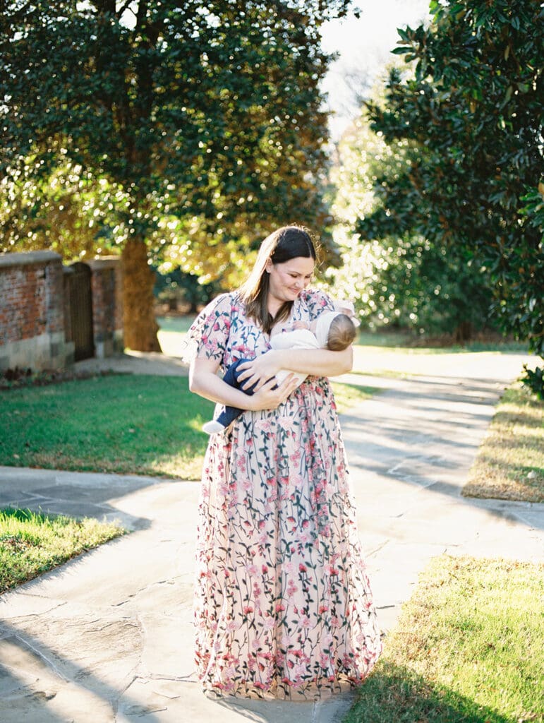 A woman smiling while looking at her baby at a Richmond family photography session by Katie Stansfield Photography.