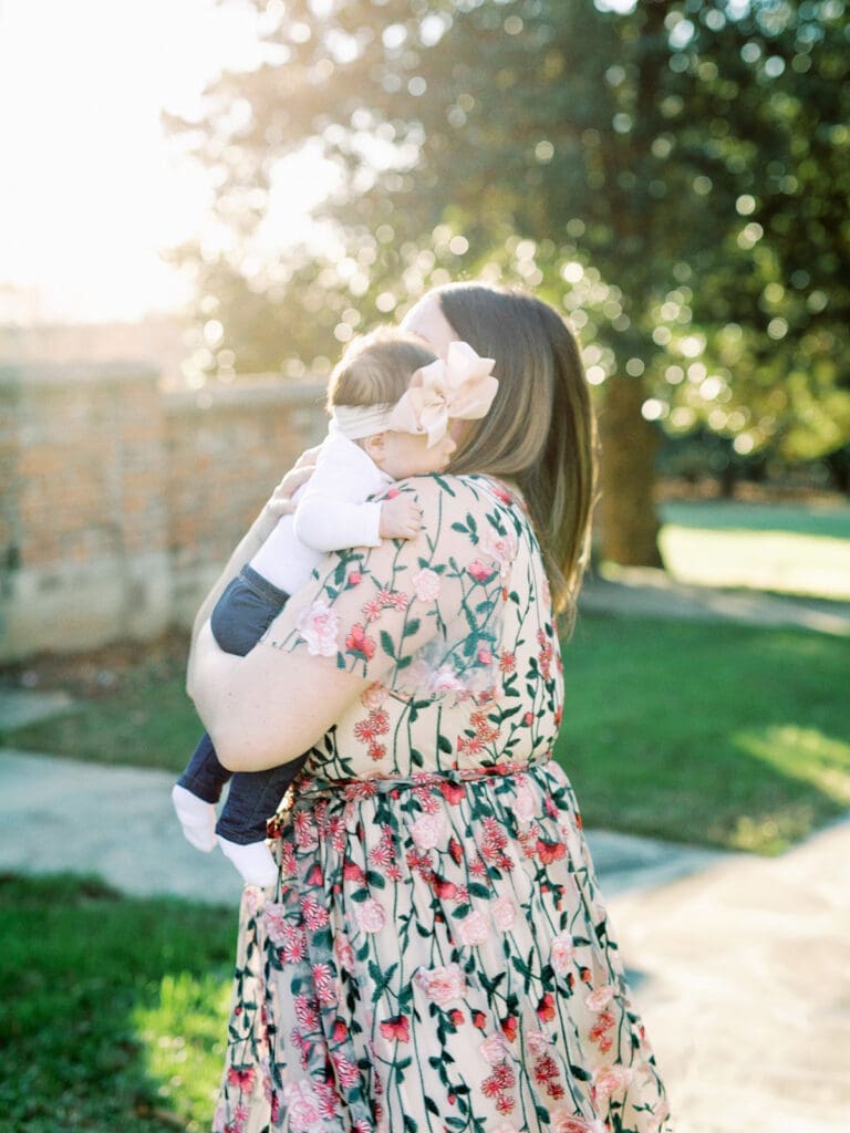 A mom hugging her baby at a photography session by Katie Stansfield Photography.