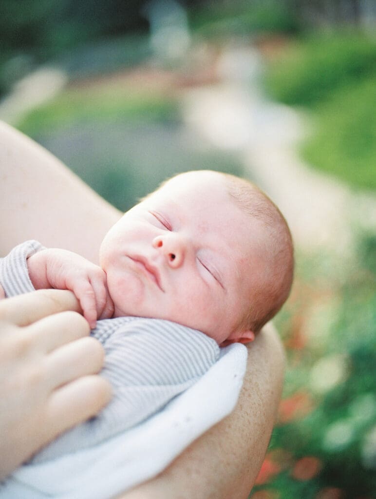 A two-week old baby sleeping at a newborn session by Katie Stansfield Photography.
